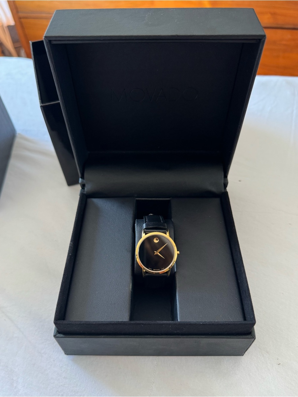 Movado Women’s Black Dial Leather Watch with Gold-Tone Case